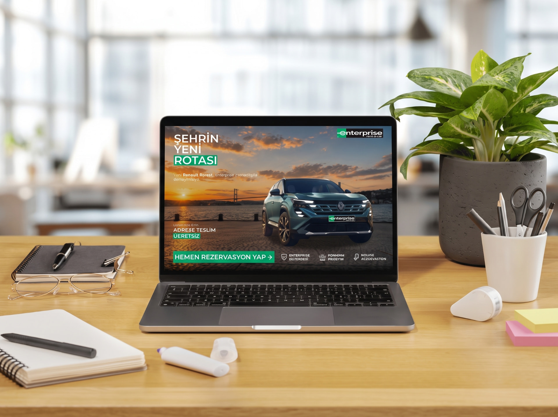 Enterprise Renault Boreal campaign shown on a laptop screen on a wooden office desk